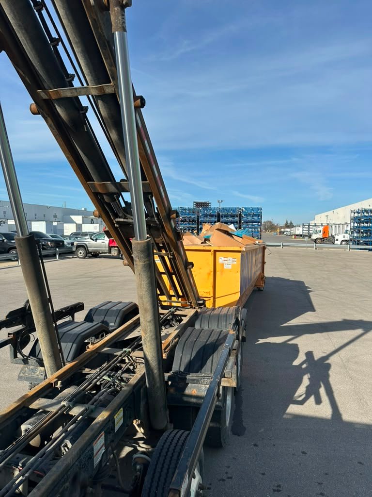 Loaded roll-off dumpster at industrial site in Detroit